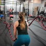 woman in black top pulling rope
